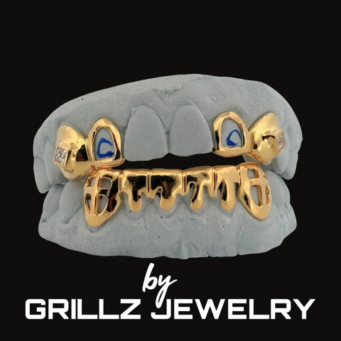 Gold and gray grill with blue accents on a black background, branded by Grillz Jewelry.