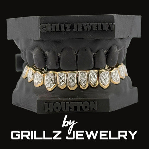 Grillz jewelry set on a black stand with 'Grillz Jewelry' branding.