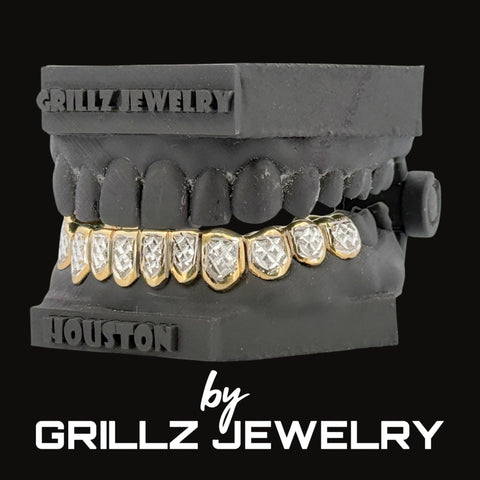 Grillz jewelry display with gold and diamond-encrusted grill on a black background, featuring the brand 'Grillz Jewelry'.