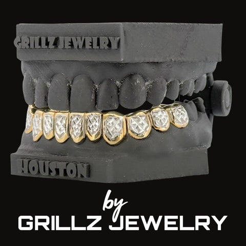 Grillz jewelry set on a black dentures model with 'Houston' branding, branded as Grillz Jewelry.