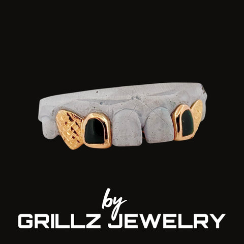Grill with concrete and gold accents on a black background, branded by Grillz Jewelry.