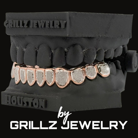Grillz jewelry set on a black stand with 'Grillz Jewelry' branding.