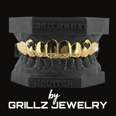Diamond-studded grillz on a stand with 'Grillz Jewelry' branding.