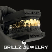 Diamond-studded grillz on a black background with 'Grillz Jewelry' branding.