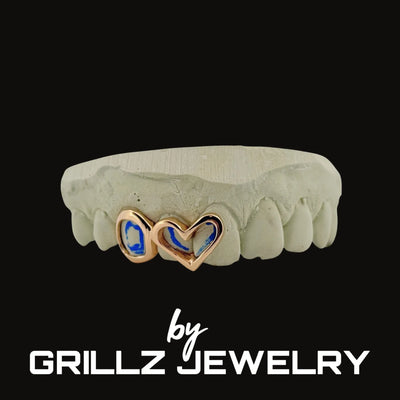 Jewelry set with heart-shaped charms on a black background, branded as Grillz Jewelry.