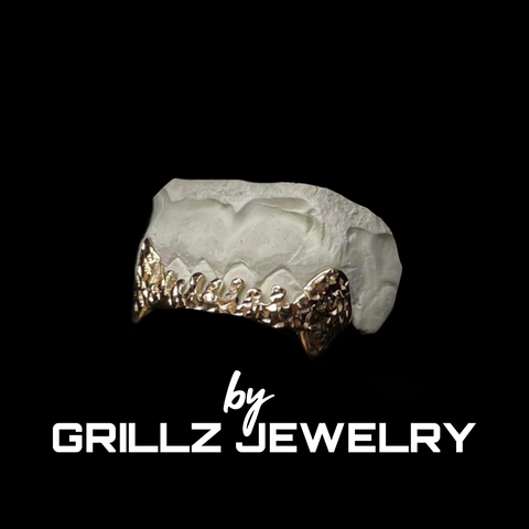 Handcrafted gold grillz that elevate your personal style with a touch of luxury.