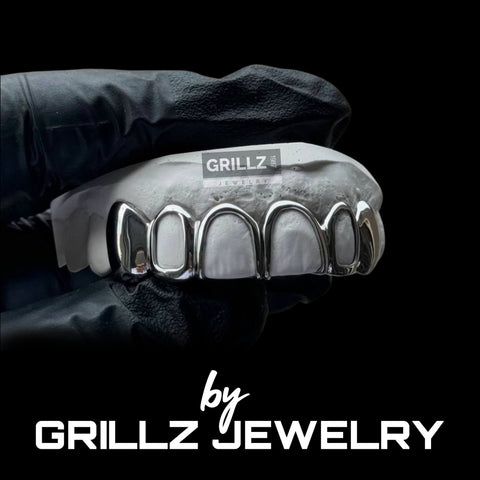 Indulge in the luxury of custom-made gold grillz, handcrafted with care and attention to detail
