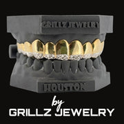 Grillz jewelry set with gold and silver teeth on a black background, branded as Grillz Jewelry.