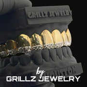 Black and gold grillz jewelry set on a black background with 'Grillz Jewelry' branding.