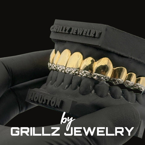 Black dental model with gold and diamond grill on a black background, featuring 'Grillz Jewelry' branding.
