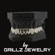 Grillz jewelry set on a black background with 'Grillz Jewelry' branding.