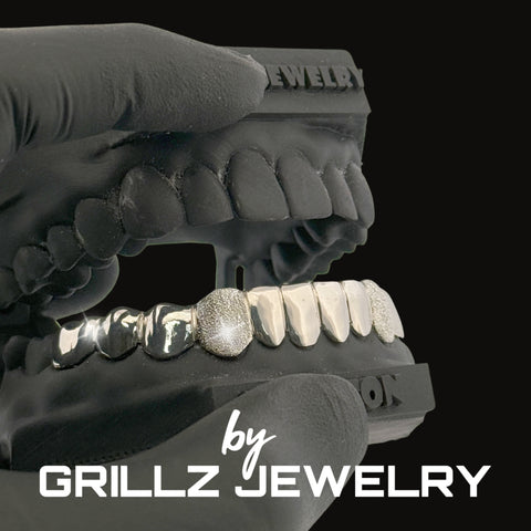 Grillz jewelry set on a black background with 'Grillz Jewelry' branding.