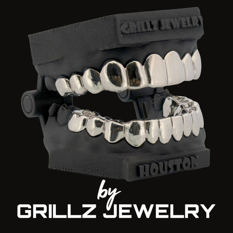 Grillz jewelry set on a black background with 'Grillz Jewelry' branding.