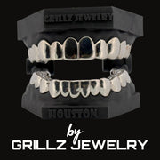 Silver grillz jewelry set on a black stand with 'Grillz Jewelry' branding.