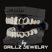 Silver grillz jewelry set on a black background with 'Grillz Jewelry' branding.