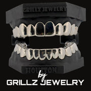 Silver grillz on a black stand with 'Grillz Jewelry' branding.