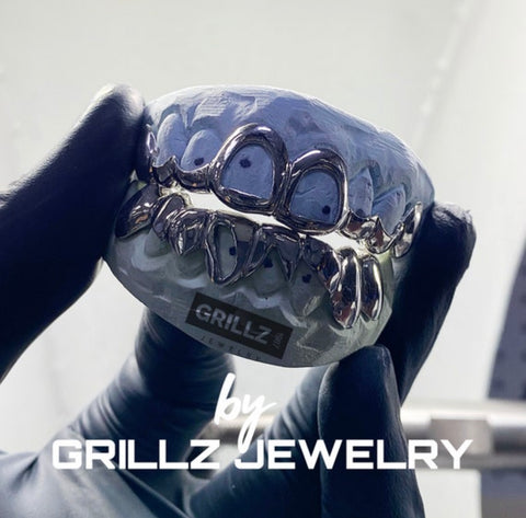 Elevate your style with our high-quality gold grillz, designed for durability and shine
