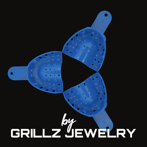Blue grill cleaner with 'by Grillz Jewelry' text on a black background