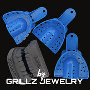 Blue and gray grill cleaners with 'GRILLZ JEWELRY' branding on a black background