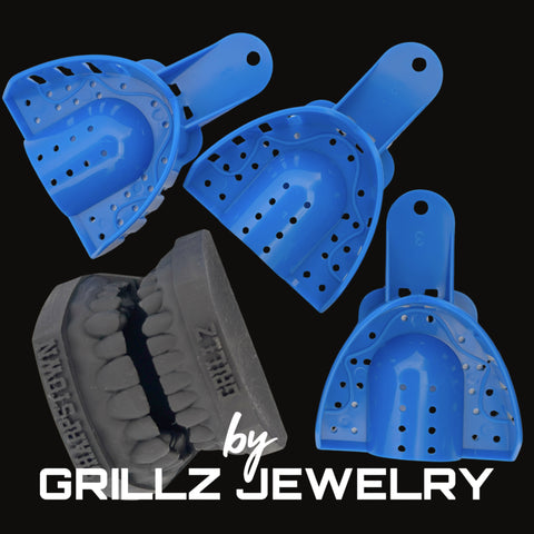 Blue and gray grill cleaners with 'GRILLZ JEWELRY' branding on a black background