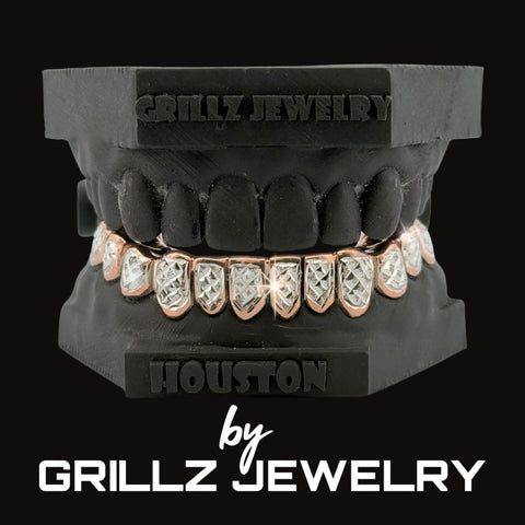 Grillz jewelry set with rose gold and clear stones on a black background, branded as Grillz Jewelry.