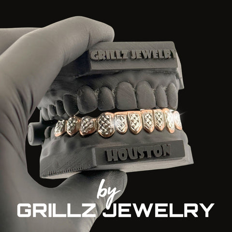 Grillz jewelry set held by a gloved hand with 'Grillz Jewelry' branding.